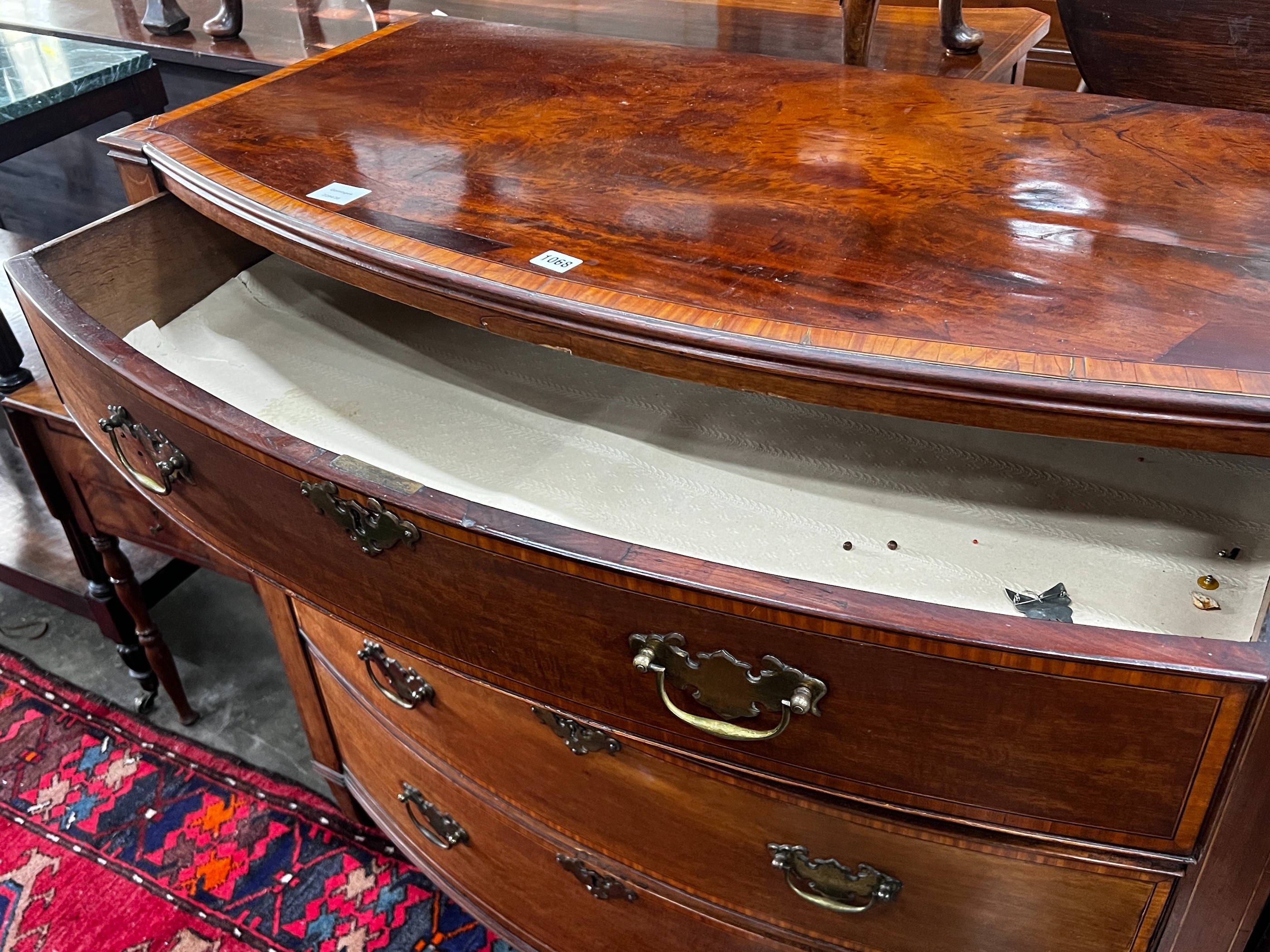 A George III satinwood banded mahogany bow front chest of drawers, width 109cm, depth 54cm, height 101cm